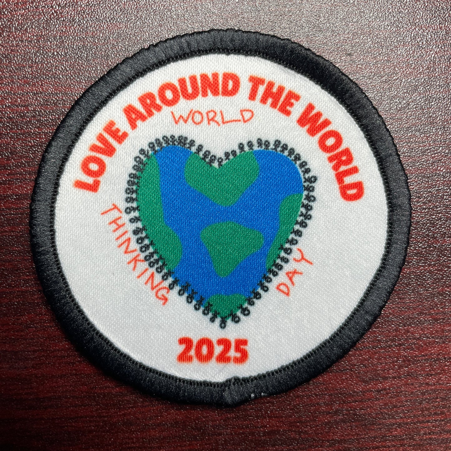 2025 World Thinking Day | Love Around the World 2.57" Round Iron-on Fun Patch | Donation to local GS Service Unit